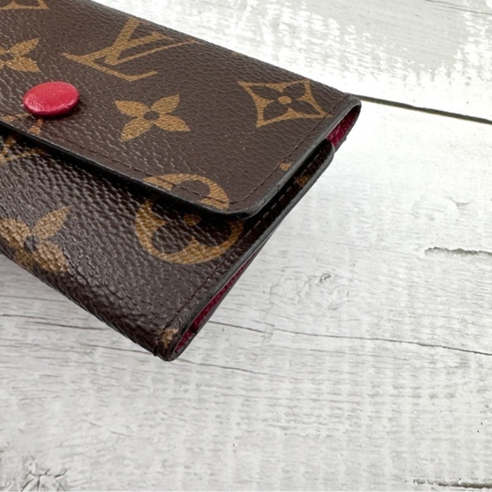 AUTHENTIC Louis Vuitton key holder. Monogram pattern. Magenta interior. - Picture 9 of 15